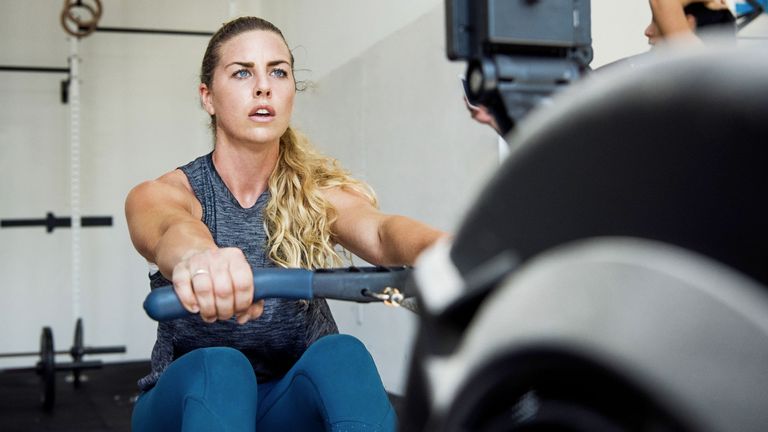 Woman doing a rowing for weight loss session