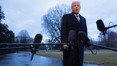 Donald Trump speaks to the press as he departs the White House en route to Mar-a-Lago last week 