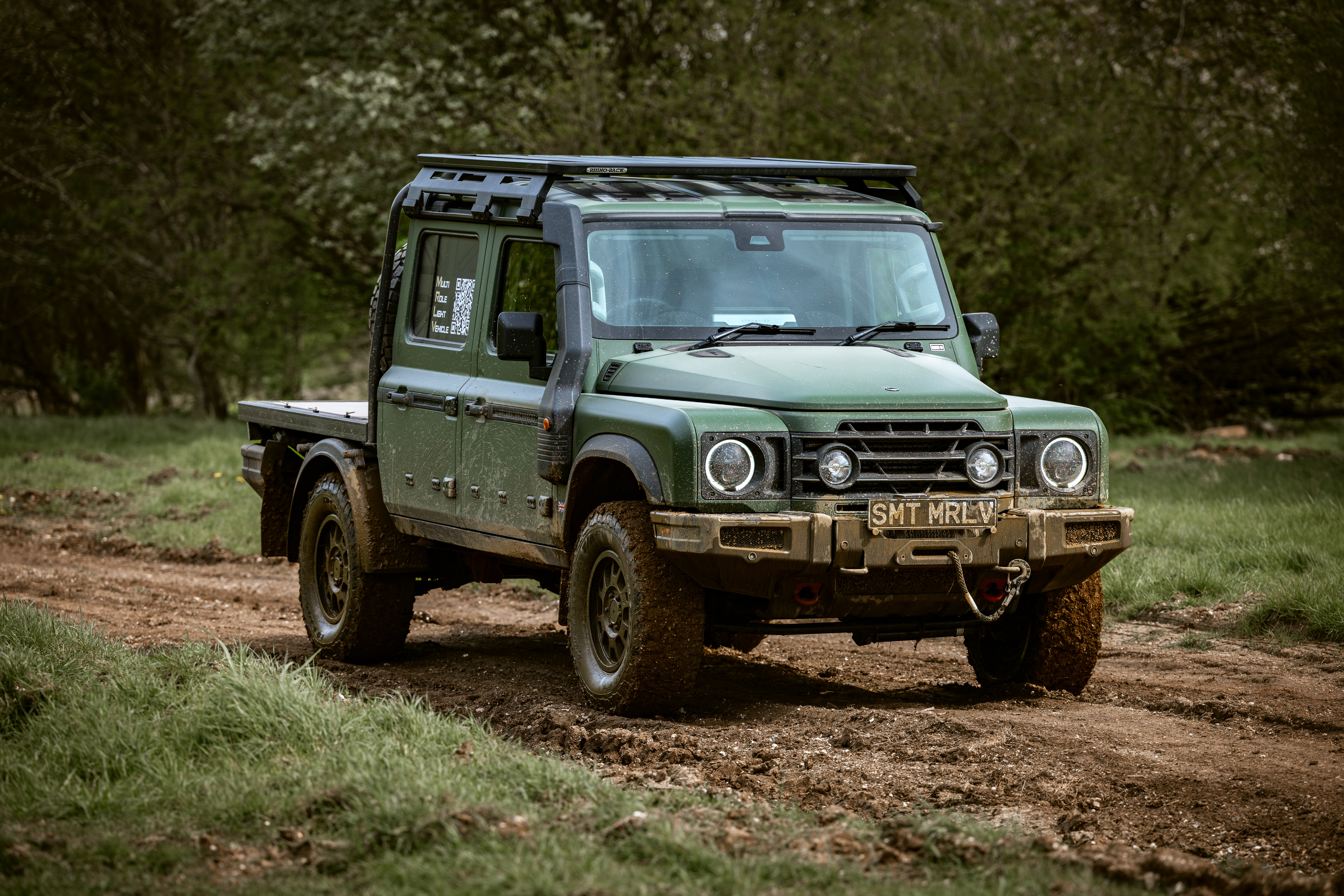 Image of the Ineos Grenadier looking exceptionally muddy. It's a flat-bed style pickup