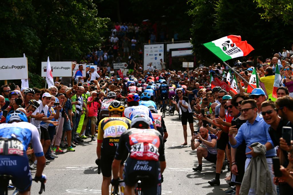 TREVISO ITALY MAY 26 A general view of the peloton beginning to climb the Muro di Ca del Poggio 237m while fans cheer during the 105th Giro dItalia 2022 Stage 18 a 156km stage from Borgo Valsugana to Treviso Giro WorldTour on May 26 2022 in Treviso Italy Photo by Tim de WaeleGetty Images