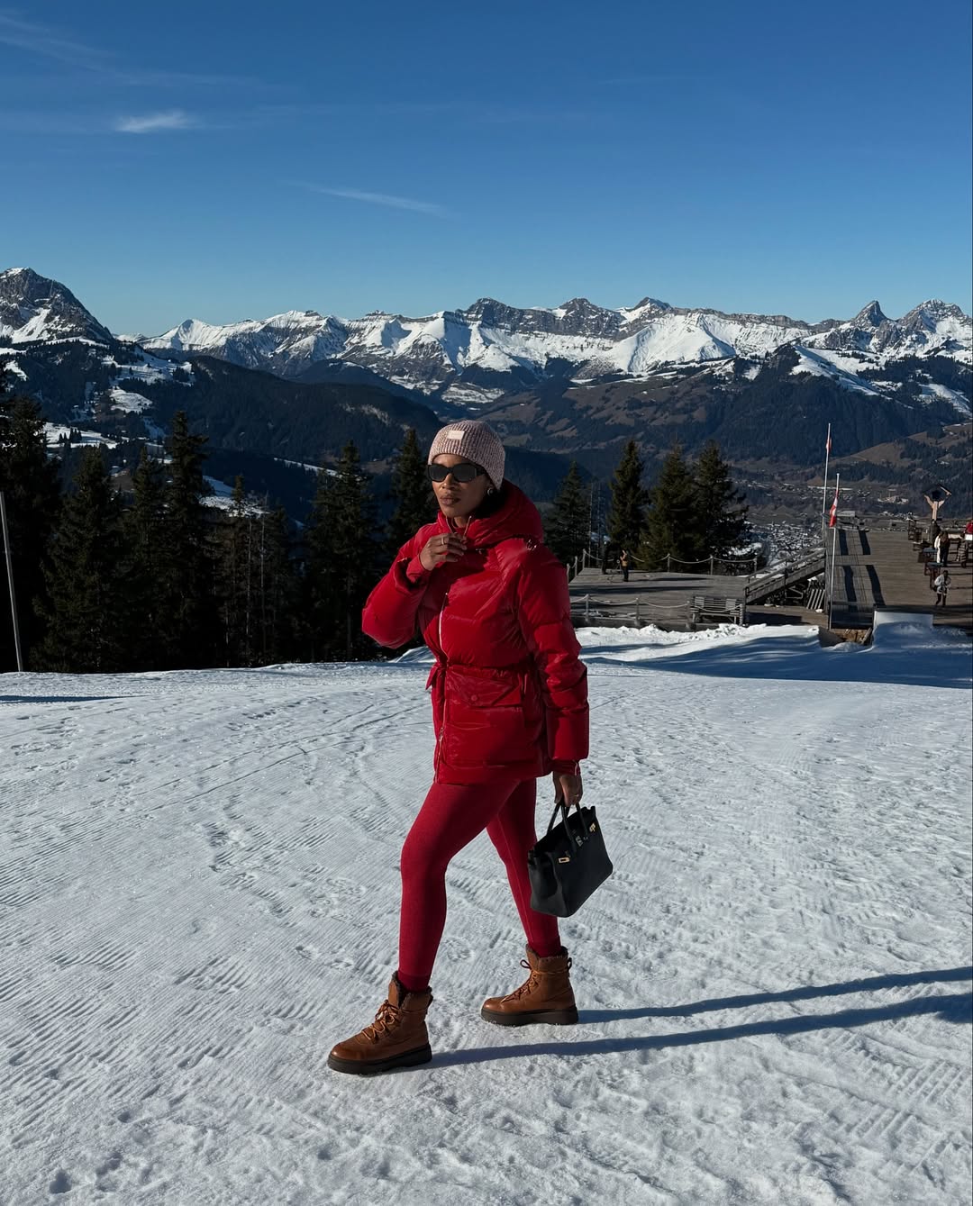 @nlmarilyn wears red leggings red coat in snow