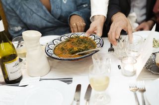 Dish of Tomato, monk’s beard & bottarga on table at a Wallpaper* party