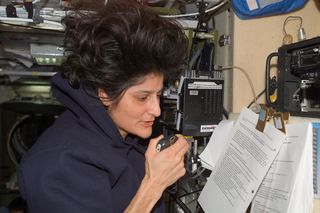 Astronaut Sunita L. Williams, Expeditions 14 and 15 flight engineer, talks with students at the International School of Brussels in Belgium during an ARISS in the Zvezda Service Module.