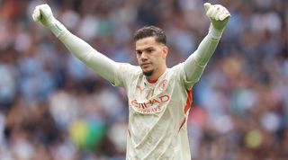 Ederson celebrates during Manchester City's Community Shield win over Manchester United on penalties in August 2024.