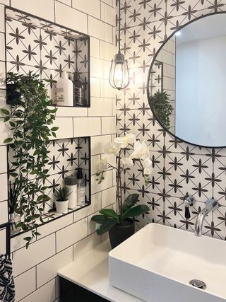tiled bathroom wall with built-in alcoves