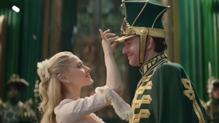 Glinda fixing Fiyero's hat in Wicked: For Good