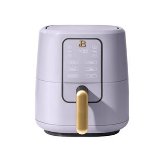 A purple small Beautiful by Drew Barrymore air fryer with a gold handle on it