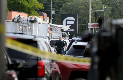 Orlando police surround the crime scene outside Pulse