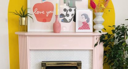 pink fireplace in living room with yellow arch wall