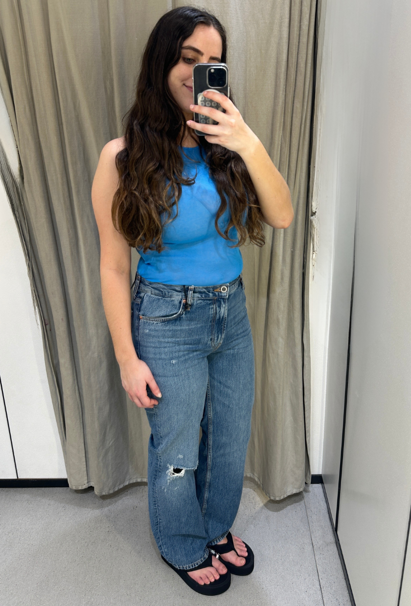 An image of Who What Wear UK SEO Writer, Ava Gilchrist, wearing Zara bootcut jeans.