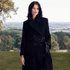 Woman wears black winter coat 