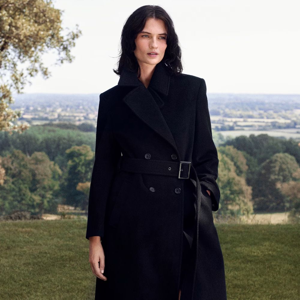 Woman wears black winter coat 