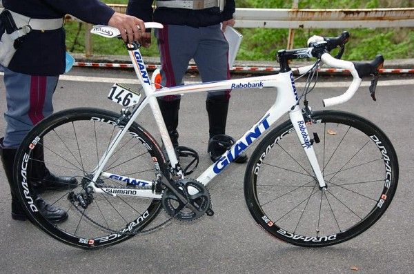 The bicycle of Pedro Horrillo is held by a policeman at the accident scene.