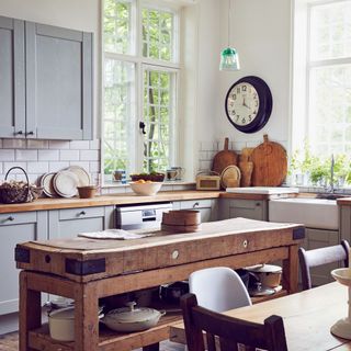country kitchen with blue cabinets and wooden island