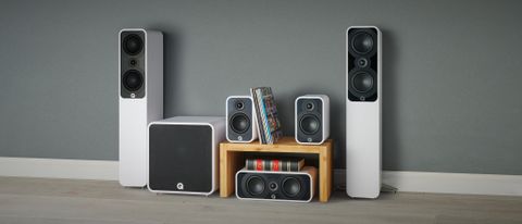 Q Acoustics 5040 5.1 speaker package in white against a grey wall