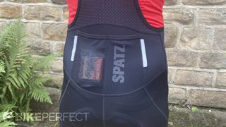 A picture showing the rear storage pockets on the lower back of the Spatzwear Convoy Cargo bib shorts