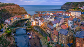 A view across the seaside village Staithes at dusk