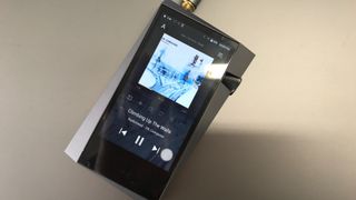 Astell & Kern A&norma SR25 MKII with Radiohead playing, on white background