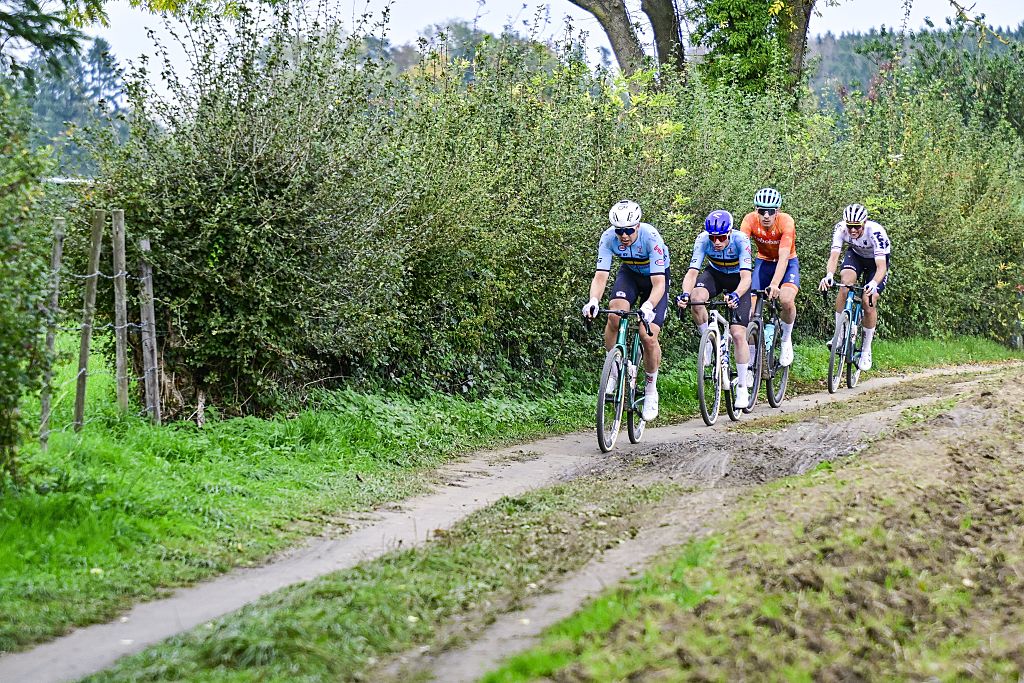 Head of the race, 07 Belgian Florian Vermeersch, Belgian Floris Van Tricht, Dutch Frits Biesterbos and German Nils Politt pictured in action during the men elite race at the UCI World Gravel Championships, Sunday 12 October 2025, in Maastricht, The Netherlands. BELGA PHOTO DIRK WAEM (Photo by DIRK WAEM / BELGA MAG / Belga via AFP)