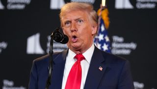WASHINGTON, DC - AUGUST 13: U.S. President Donald Trump mocks Federal Reserve Chair Jerome Powell as he speaks during an event at the Kennedy Center on August 13, 2025 in Washington, DC. Trump announced the first nominees of the annual Kennedy Center Honors since taking control of the center’s board earlier this year. (Photo by Andrew Harnik/Getty Images)