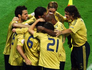 Xavi Hernandez celebrates with his Spain team-mates after scoring against Russia in the semi-finals of Euro 2008.