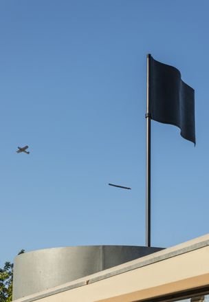A large black flag sculpture