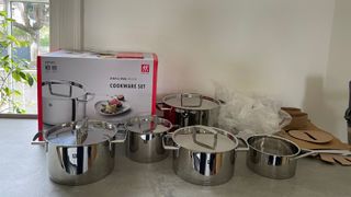 Zwilling Passion Stainless Steel Pot Set with the packaging around it