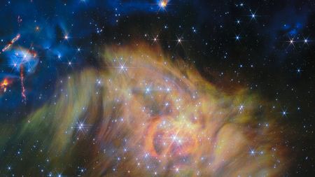 A swirling landscape of dust and dwarf stars in one of the largest JWST photos ever released