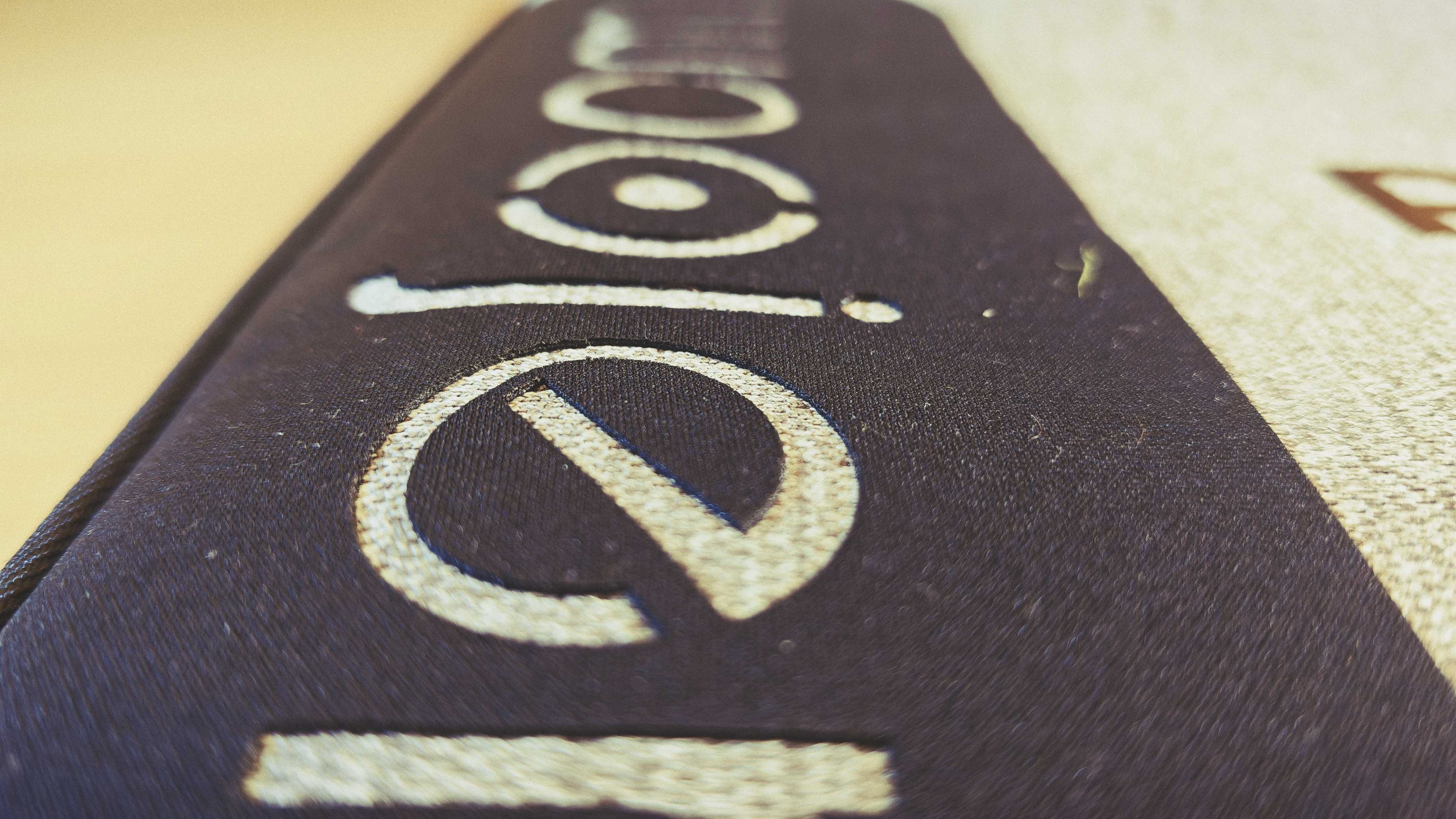 A Woojer Mat on a wooden floor