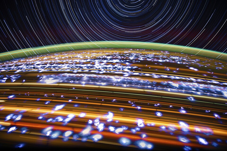 An image of star trails and lightning in a long exposure taken from the ISS