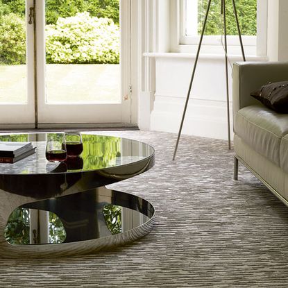 living room with white wall and wine glass on table