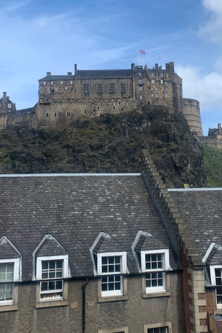view of Edinburgh Castle above houses in grassmarket Edinburgh Scotland