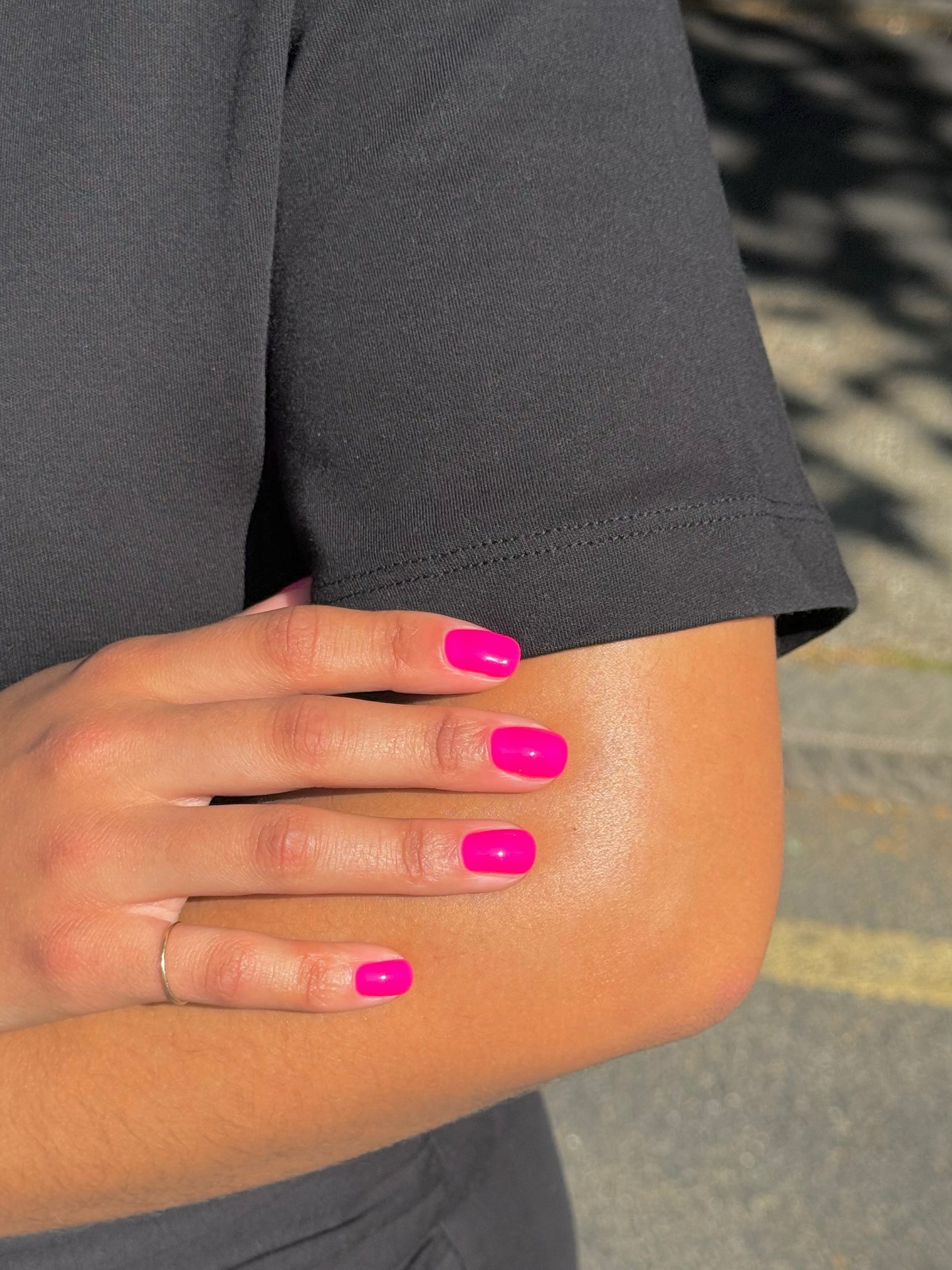 A bright pink manicure