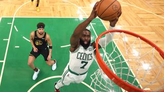 Jaylen Brown #7 of the Boston Celtics dunks the ball against Klay Thompson #11 of the Golden State Warriors in the third quarter during Game Three of the 2022 NBA Finals at TD Garden on June 8, 2022 in Boston, Massachusetts.