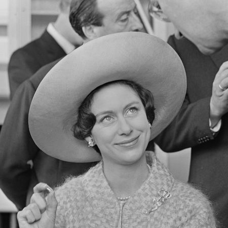 Princess Margaret wearing a large hat and looking up 