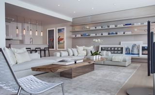 The luxe-beach vibe with white washed driftwood panels, leather, and sand-toned mats