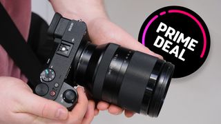 A person holds a Sony camera with a large lens, featuring a graphic overlay promoting a "Prime Deal"