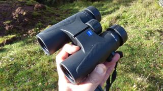 Zeiss Terra ED 8x32 binoculars in person's hand