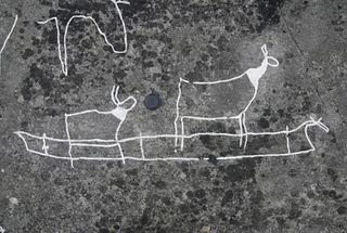 A rock art drawing of two deer in a boat.