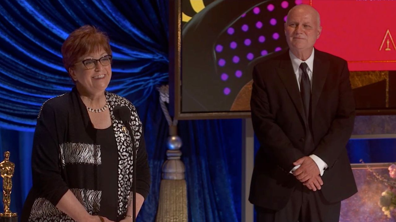 Jan Pascale and Donald Graham Burt accept the Oscar for production design for 'Mank'