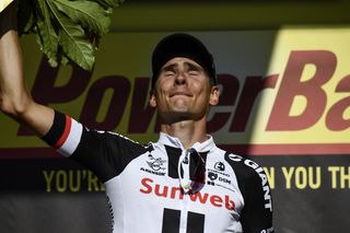 Warren Barguil on the Tour de France podium after winning stage 18