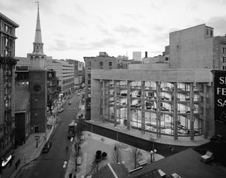 Black and white photo of curved large building