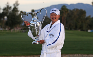 Jin Young Ko holds the ANA Inspiration trophy in 2019