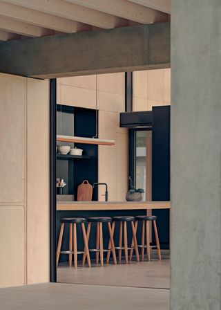 kitchen area with bar stools