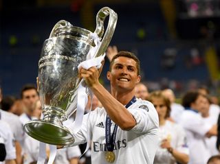 Cristiano Ronaldo celebrates with the Champions League trophy after Real Madrid's win over Atletico Madrid in the 2016 final in Milan.
