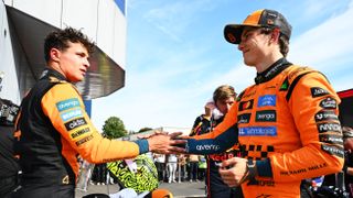 Second placed Lando Norris of Great Britain and McLaren and Third placed Oscar Piastri of Australia and McLaren congralate each other in parc ferme during the F1 Grand Prix of Italy at Autodromo Nazionale Monza on September 07, 2025 in Monza, Italy. 