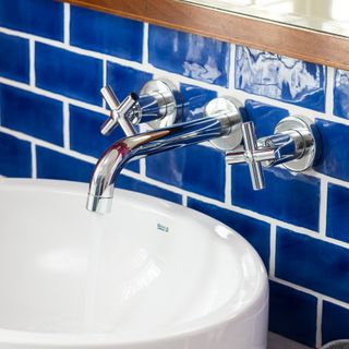 Bathroom sink with blue tiles