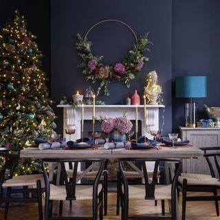 dining room with christmas tree and fireplace
