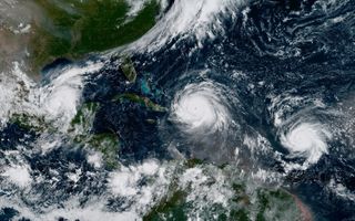 A geocolor image from GOES-16 shows Hurricane Katia (left) Hurricane Irma (middle) and Hurricane Jose (right) in the Atlantic Ocean on September 7, 2017.