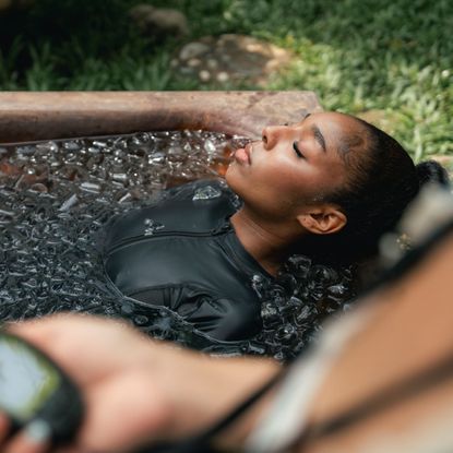 A woman doing a cold plunge